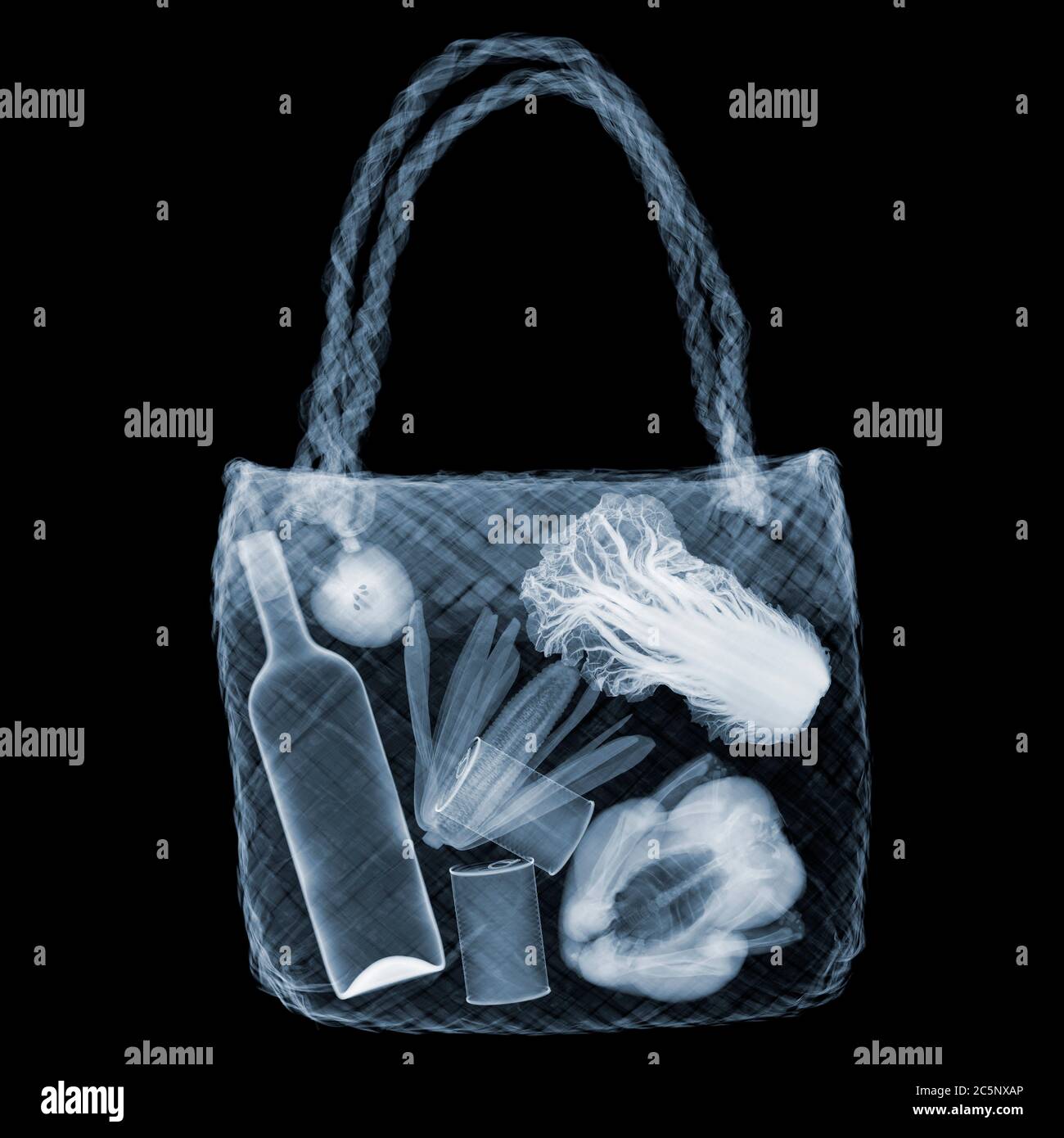 Straw bag with items, X-ray. Stock Photo