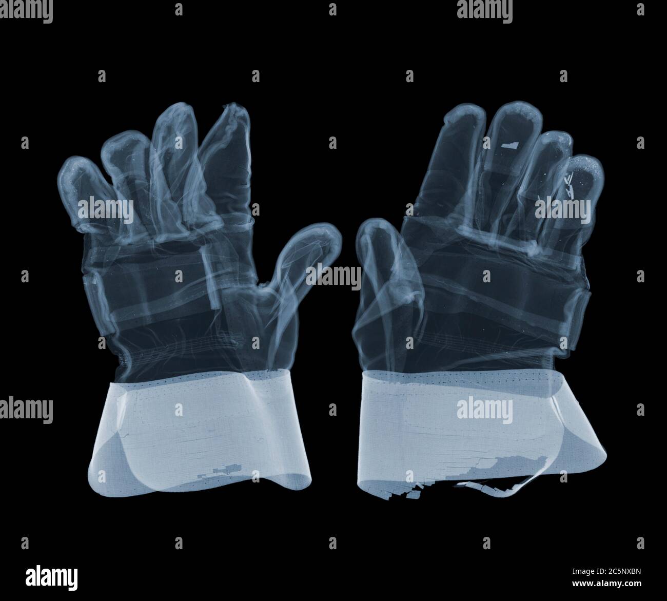 Pair of work gloves, coloured X-ray. Stock Photo