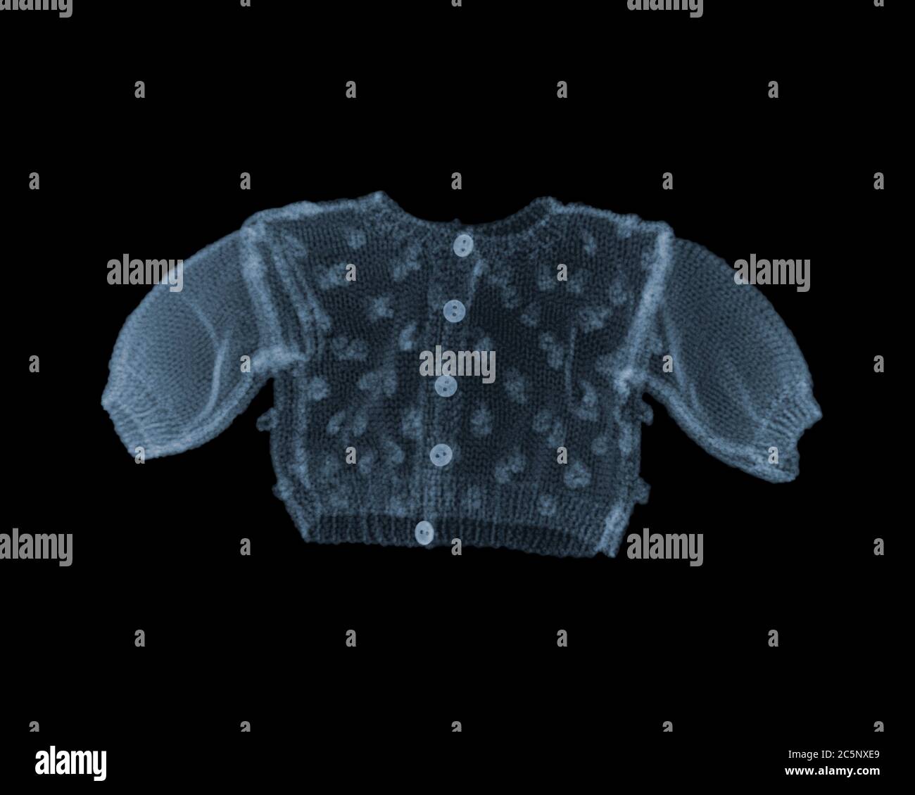 Doll knitted jumper, coloured X-ray. Stock Photo