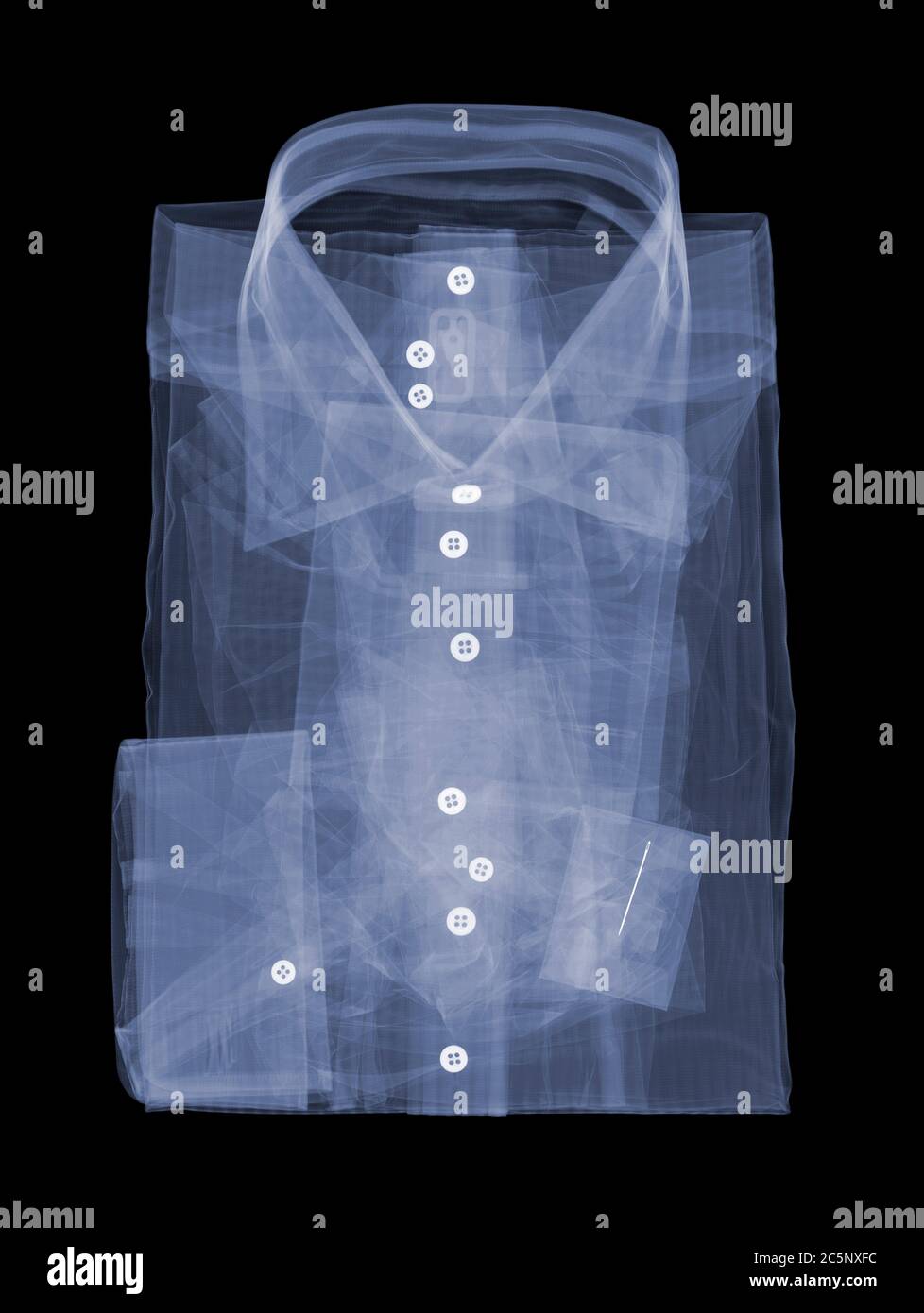 Folded shirt, coloured X-ray. Stock Photo