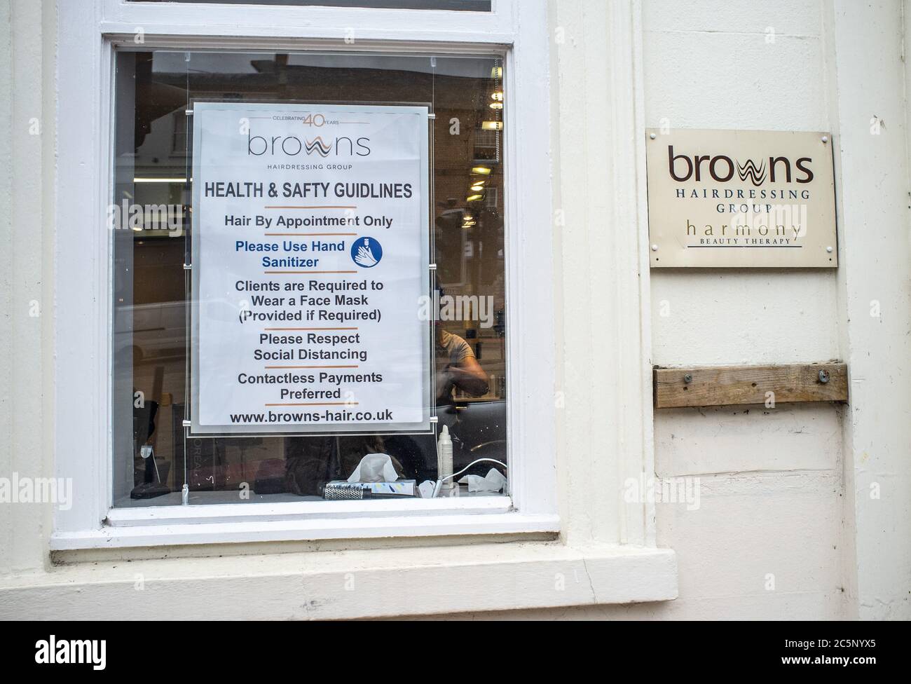 4th July 2020 Buckingham Town Centre, Buckinghamshire, UK. Health and Safety guidelines displayed in the window at Brown's hairdressing  salon in preparation for lockdown easing. Bridget Catterall/ Alamy Live News. Stock Photo