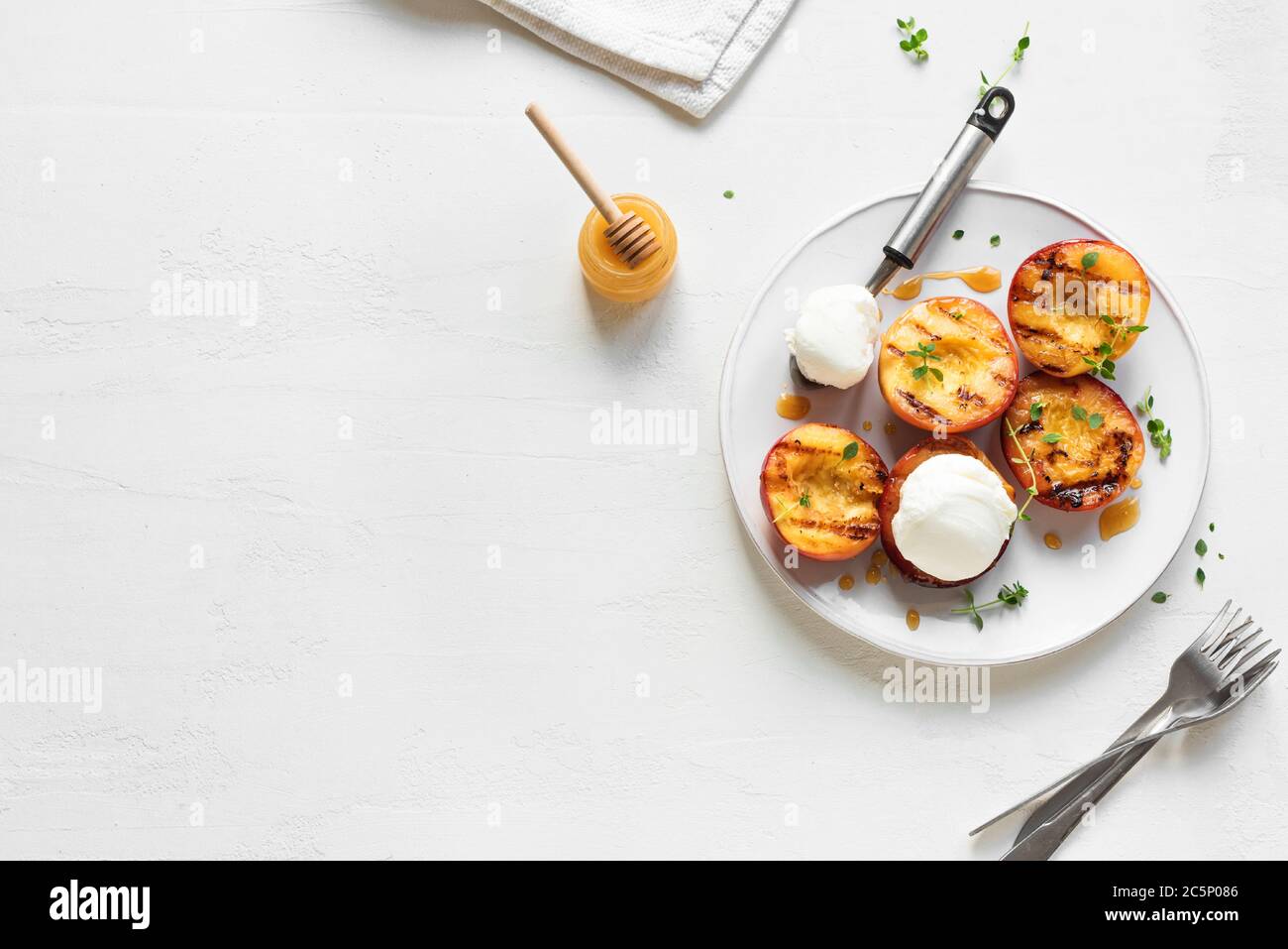 Grilled Peaches with Thyme, Honey and scoop of Vanilla Ice Cream on