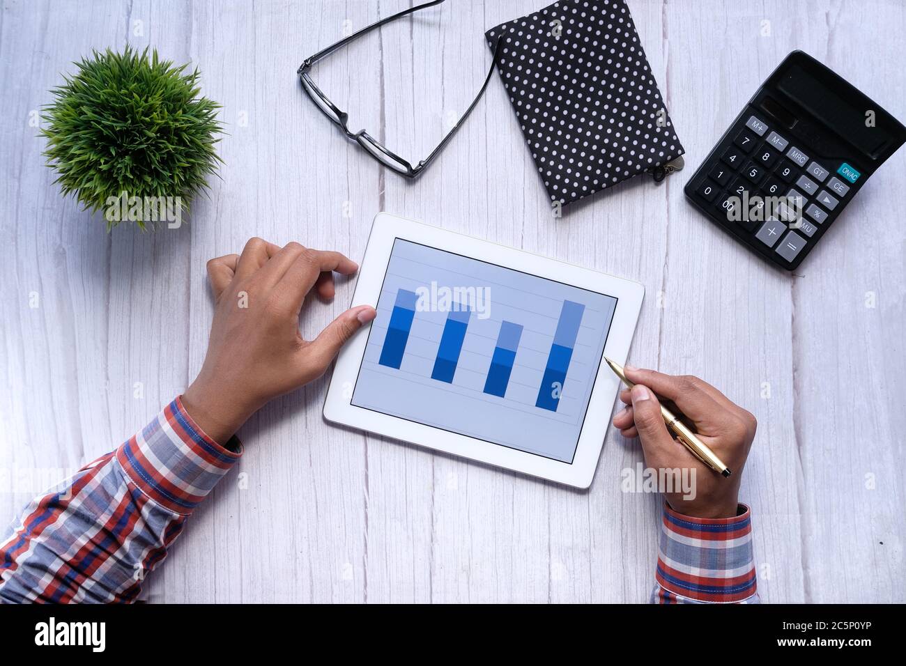 analyzing financial chart on digital tablet at night  Stock Photo