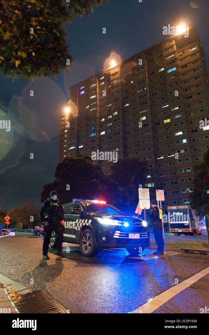 Melbourne, Australia. 04th July, 2020 Some of the 500 Victoria Police block traffic entering the public housing flats in Flemington, Australia on Saturday night as part of a Victorian state government Covid-19 lock down. Credit: Michael Currie/Alamy Live News Stock Photo