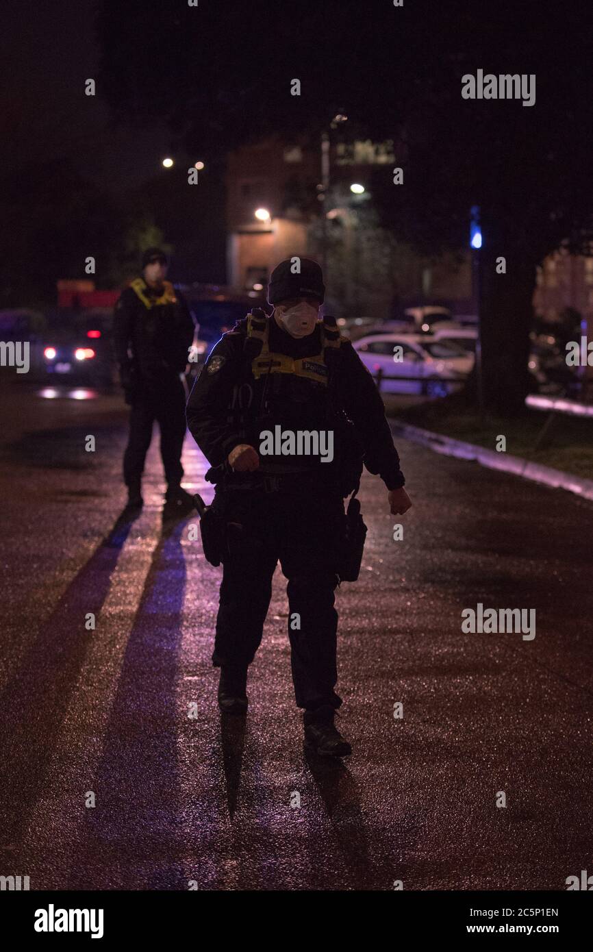 Melbourne, Australia. 04th July, 2020 Victoria Police take control of the public housing flats and their 3000 residents in Flemington, Australia on Saturday night as part of a Victorian state government Covid-19 lock down. Credit: Michael Currie/Alamy Live News Stock Photo