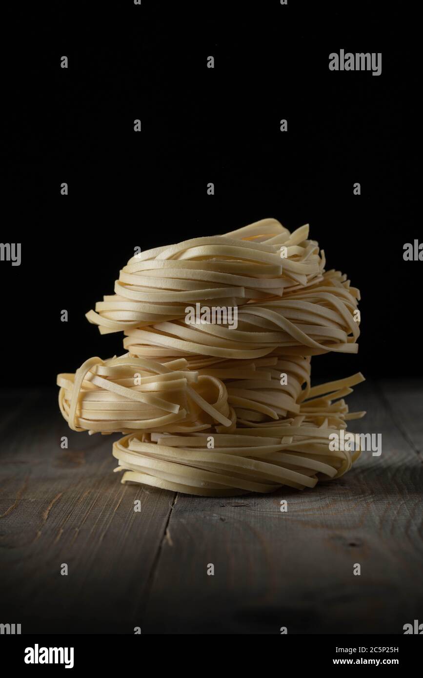 raw egg noodles stacked Stock Photo Alamy
