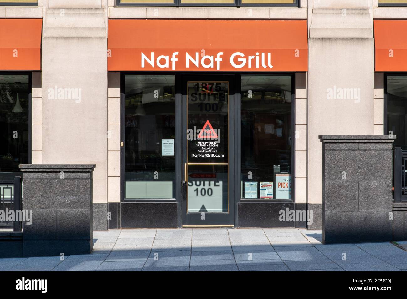 A man walks past the entrance of a Naf Naf clothing store on January  News Photo - Getty Images
