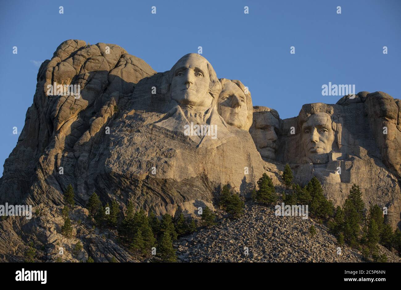 Keystone, United States. 04th July, 2020. The first light of the day hits Mt.Rushmore National Monument in Keystone, South Dakota on Saturday, July 4, 2020. President Donald Trump condemned the toppling of Confederate statues and announced an executive order to establish a statuary garden during his appearance at Mount Rushmore on the eve of the Fourth of July. Photo by Bob Strong/UPI Credit: UPI/Alamy Live News Stock Photo