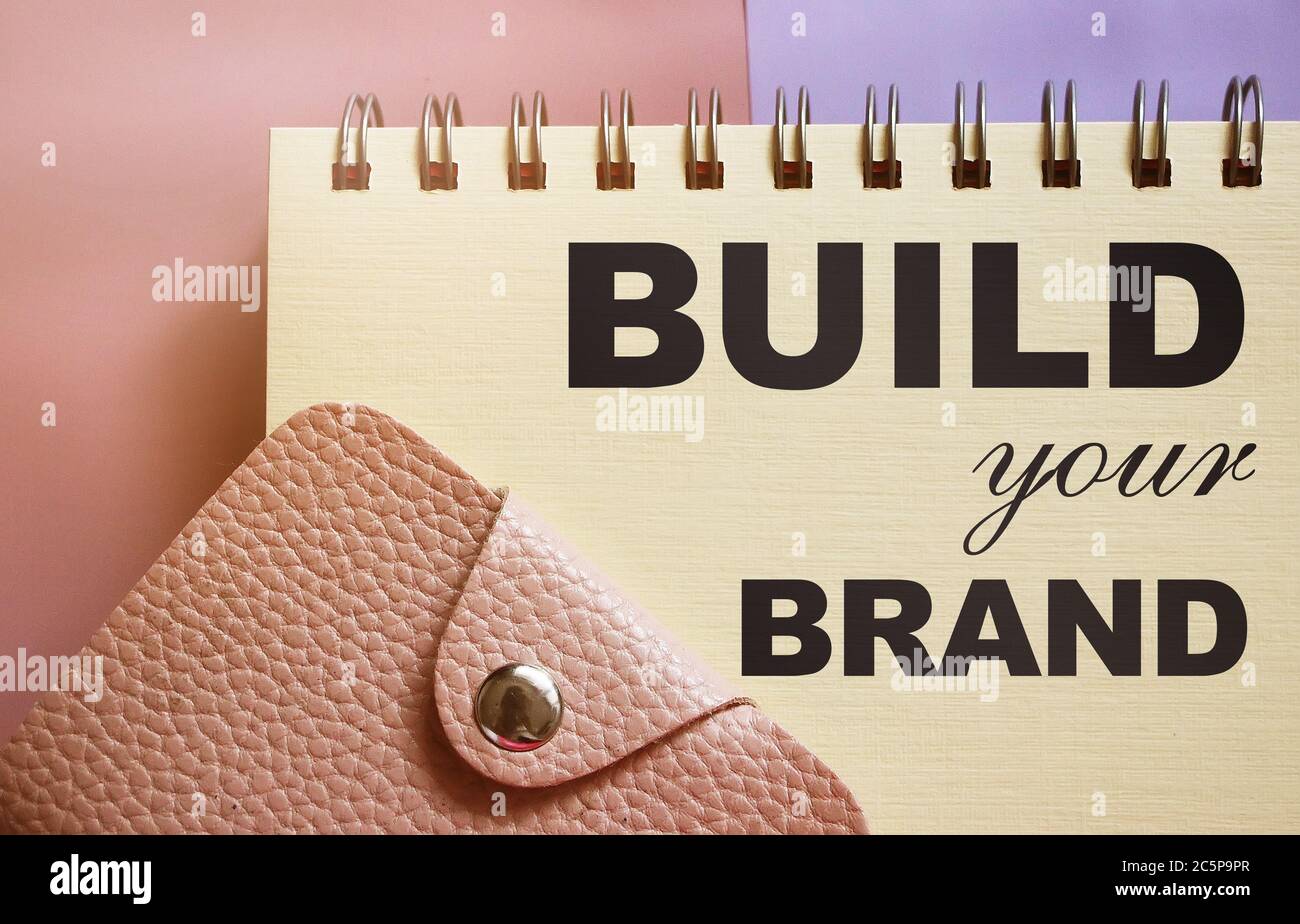 Build Your Brand text on a page of copybook and wallet. business concept Stock Photo