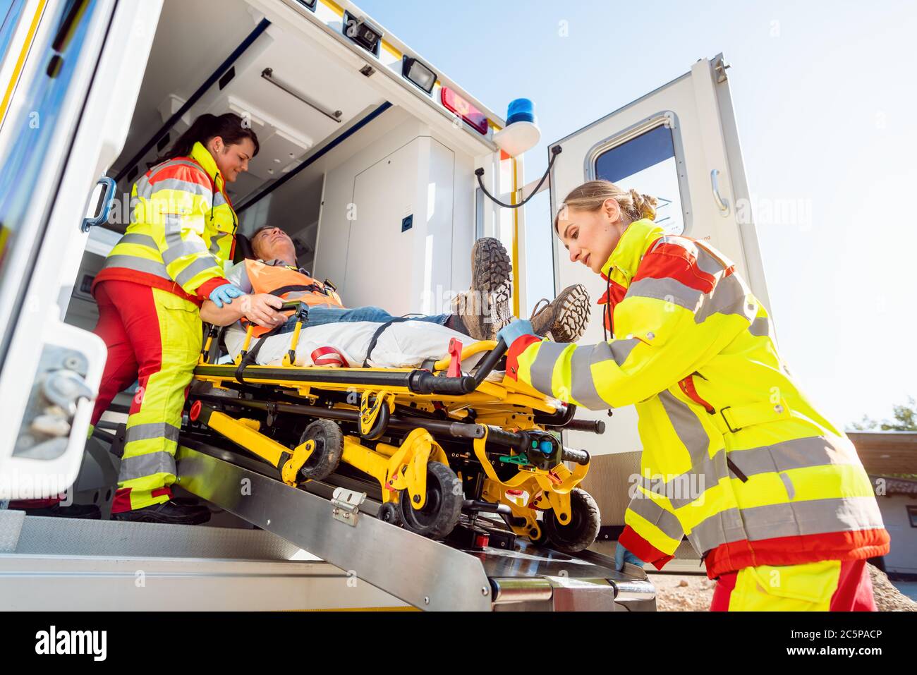 Injured woman on stretcher hi-res stock photography and images - Alamy