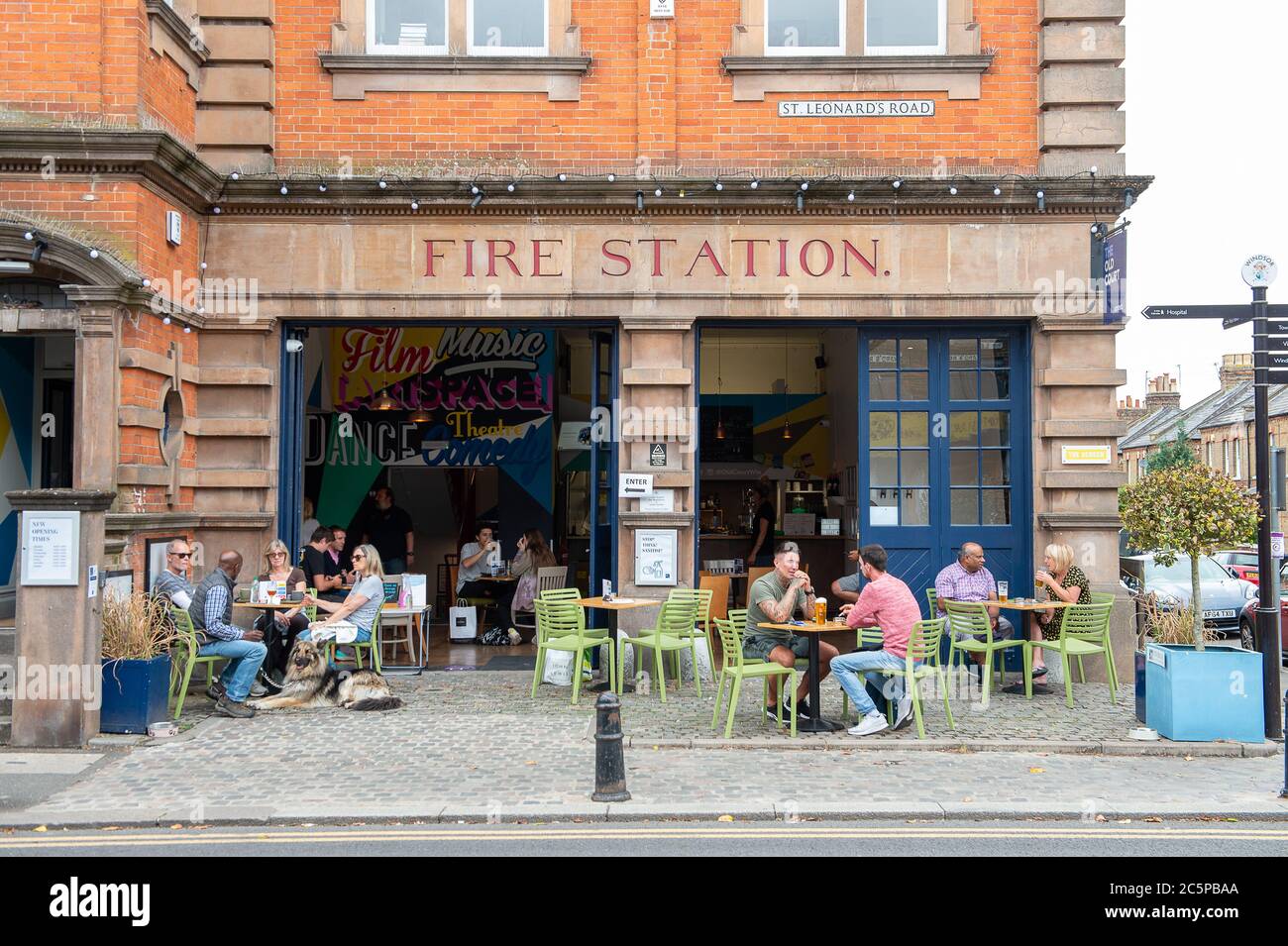 Windsor, Berkshire, UK. 4th July, 2020. Pub goers sit at tables outside the Old Court at the former Fire Station building in Windsor, Berkshire. Pubs in England were allowed to reopen today for the first time since the Coronavirus lockdown in March. Credit: Maureen McLean/Alamy Live News Stock Photo