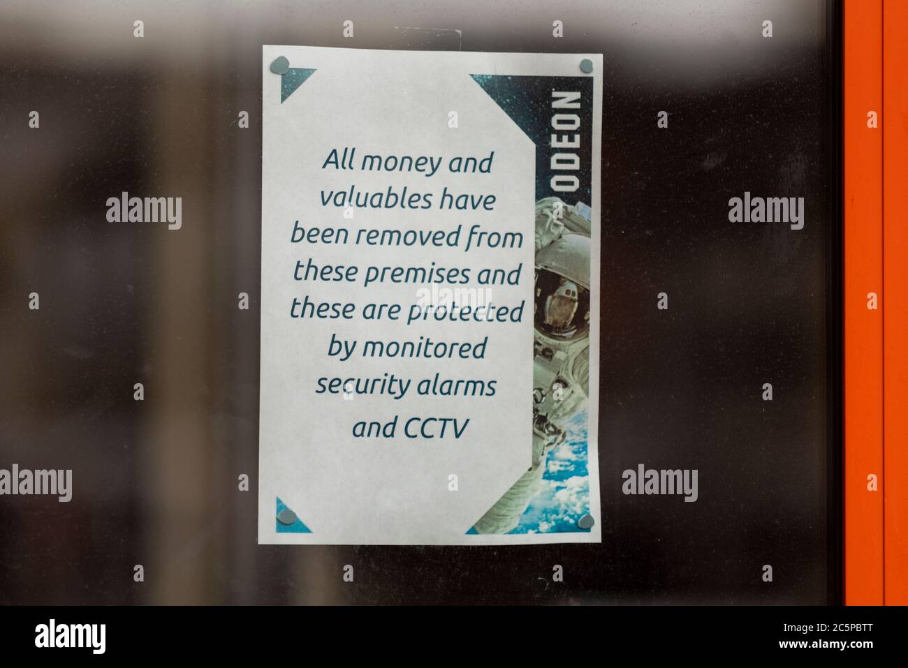 Sign in window of Odeon cinema in Southend on Sea, Essex, UK, closed during COVID-19 Coronavirus lockdown. Message no money or valuables on premises Stock Photo