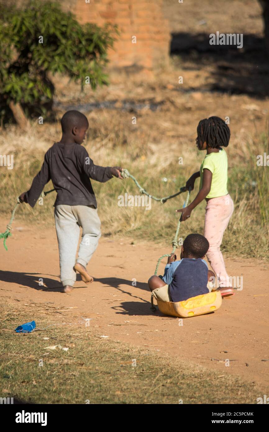 Children poverty playing toys hi-res stock photography and images - Alamy