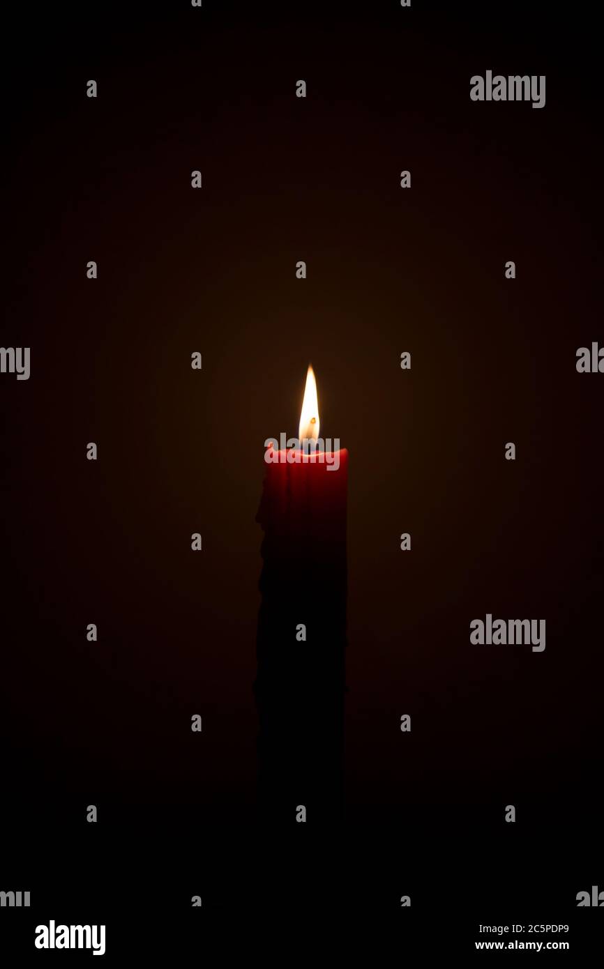 Candle light flame in a dark room Stock Photo Alamy