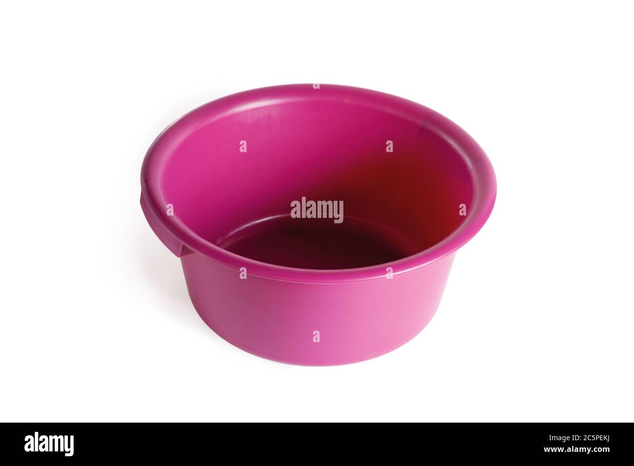 Plastic pink basin. Close-up. Isolated over white background. Stock Photo