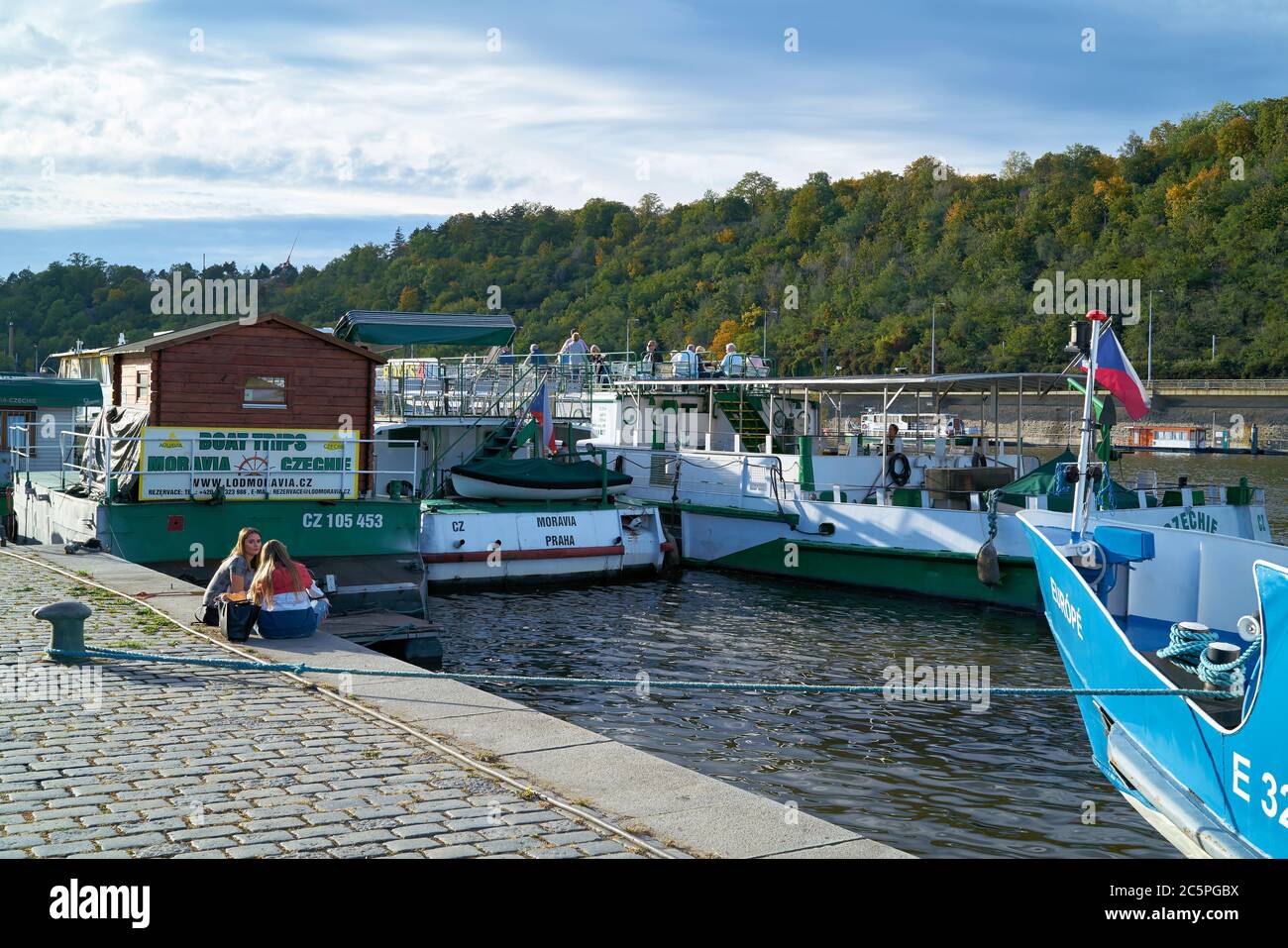 Pier for excursion boats on the bank of the Vltava River in Prague Stock Photo