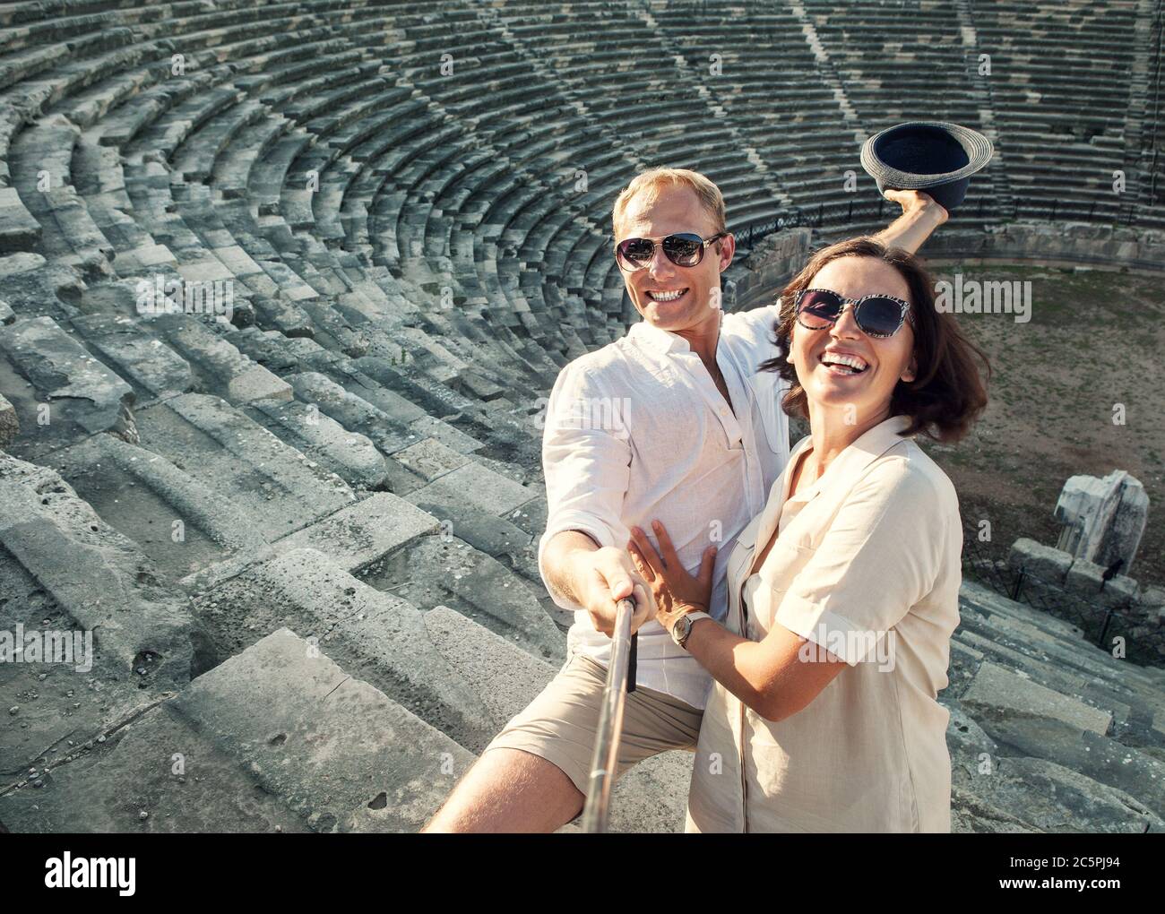 Couple take summer vacation photo with selfie stick in the ancient Theatre  arena Side Antik Tiyatro,Turkey Stock Photo - Alamy