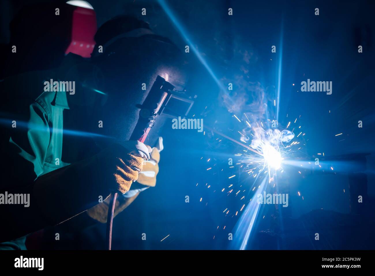 Metal welding steel works using electric arc welding machine Stock