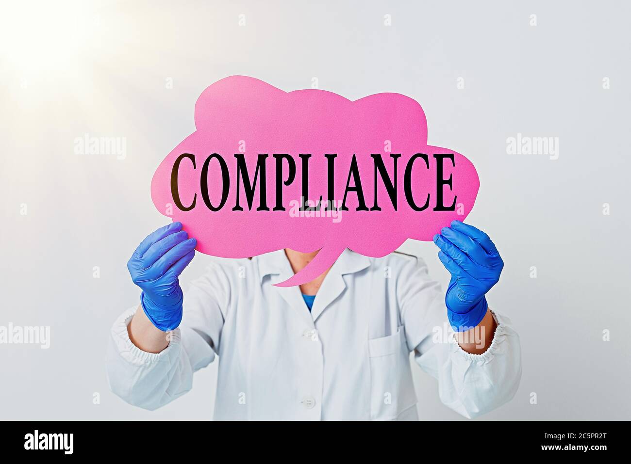 Text sign showing Compliance. Business photo text the action or fact of complying with a wish or commands Laboratory technician featuring empty sticke Stock Photo