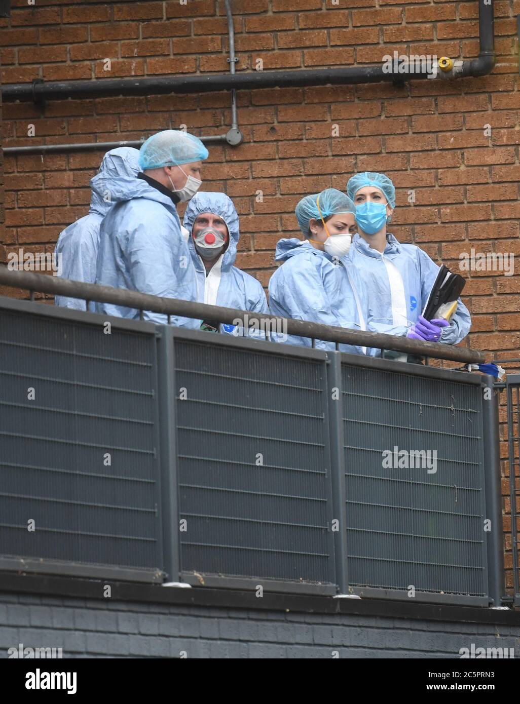 Police forensic officers at Vulcan Way on the Westbourne estate, adjacent to Roman Way, Islington, where a man in his 20s has died after being found with gunshot wounds near Pentonville prison in north London. Stock Photo