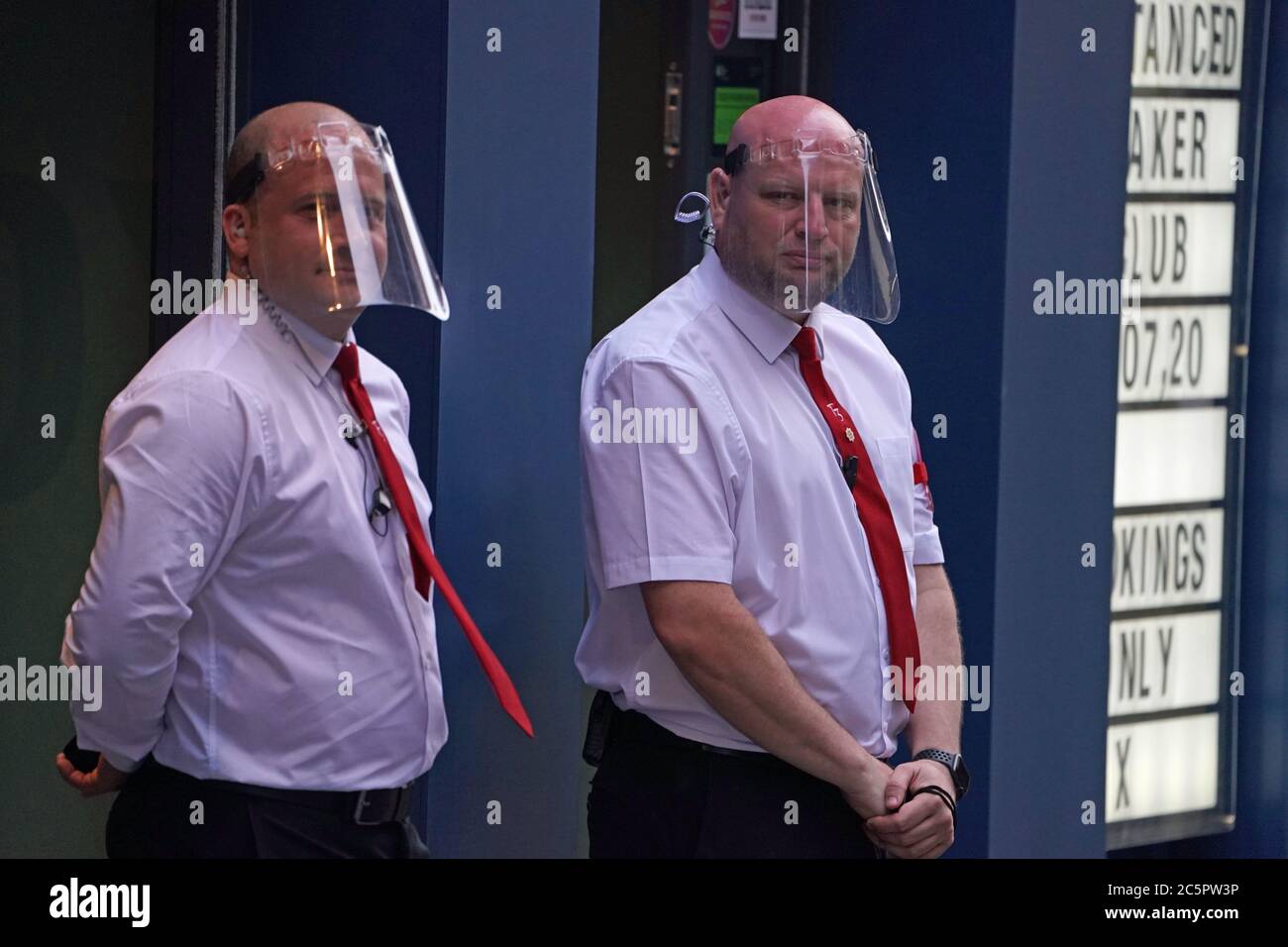 Door staff in PPE outside Market Shaker in the Bigg Market area of Newcastle, where pubs and bars have reopened following the easing of coronavirus lockdown restrictions across England. Stock Photo