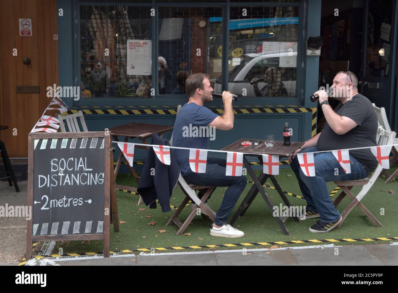 UK Social Distancing 2 metres apart. Super Saturday, London 4th July 2020 bars and pubs reopen with restrictions in place, social distancing, table service outside. Portobello Road young Londoners. 2020s England   HOMER SYKES Stock Photo