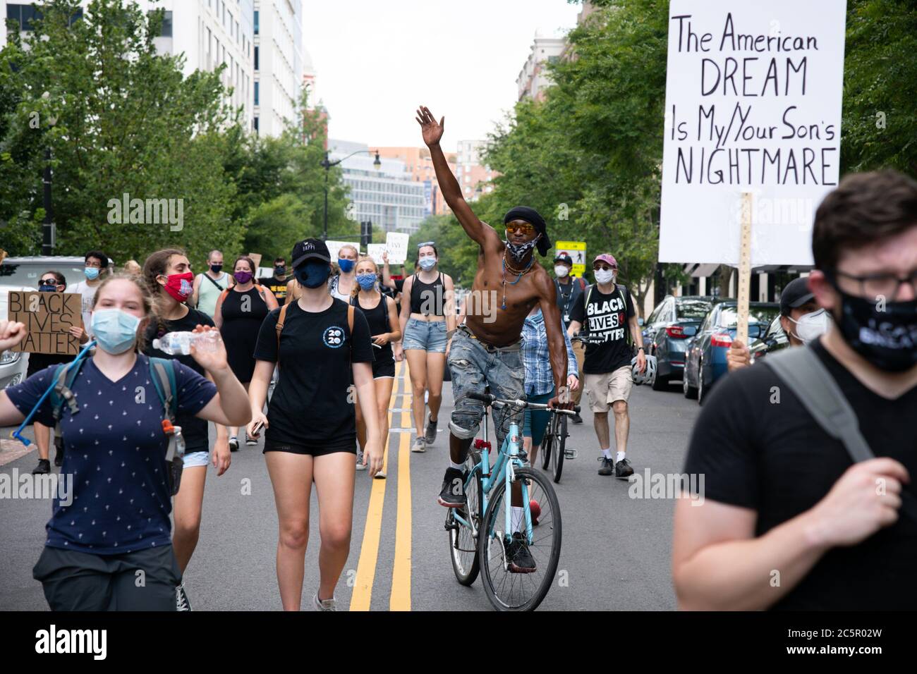 Racial justice march through downtown Washington, DC, on July 4, 2020, amid the coronavirus pandemic. Following a divisive speech by President Trump at Mt. Rushmore the night before, Fourth of July celebrations in Washington have proved controversial for the second year running - as racial justice protesters gathered for demonstrations across the city, the President's Salute to America celebration is going ahead later as planned despite CDC warnings about COVID-19 and numerous objections from local officials. (Graeme Sloan/Sipa USA) Stock Photo