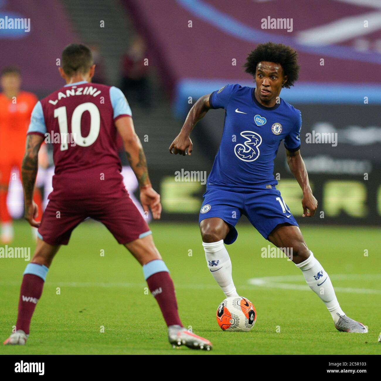 London, UK. 01st July, 2020. Willian of Chelsea (right) looks for a way past Manuel Lanzini of West Ham United (left) during the Premier League match between West Ham United and Chelsea played behind closed doors due to the COVID-19 pandemic at the Olympic Park, London, England on 1 July 2020. Photo by Andy Rowland/PRiME Media Images. Credit: PRiME Media Images/Alamy Live News Stock Photo