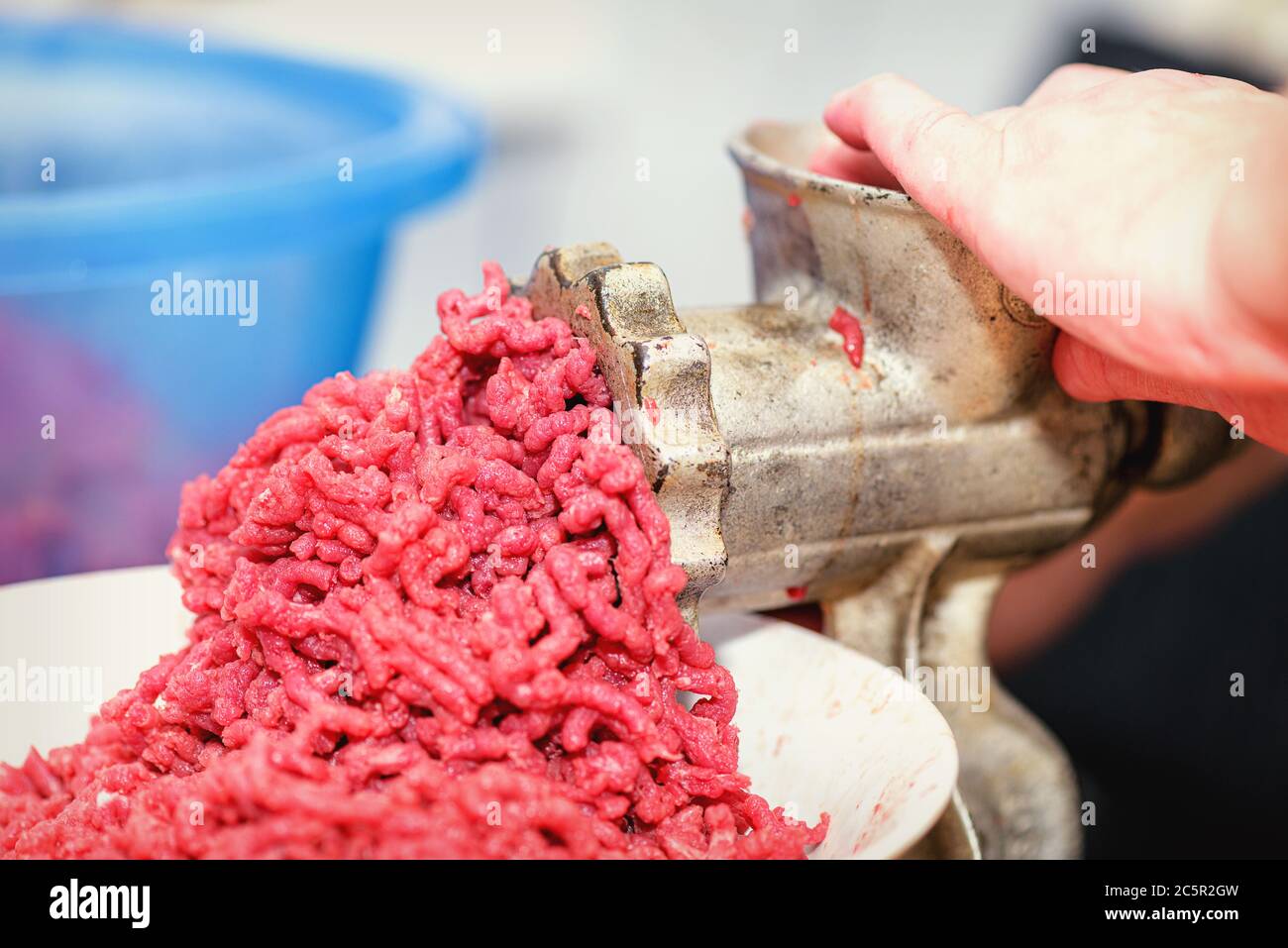 https://c8.alamy.com/comp/2C5R2GW/fresh-minced-meat-stained-manual-meat-grinder-that-smokes-meat-into-juicy-minced-meat-minced-meat-close-up-2C5R2GW.jpg