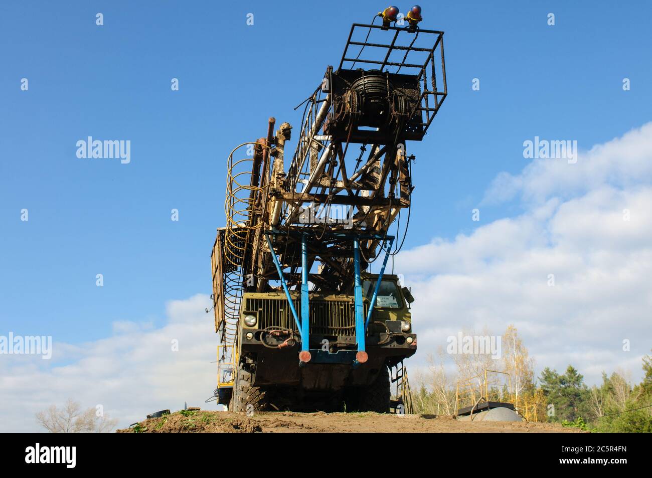 well workover rig in transport position Stock Photo