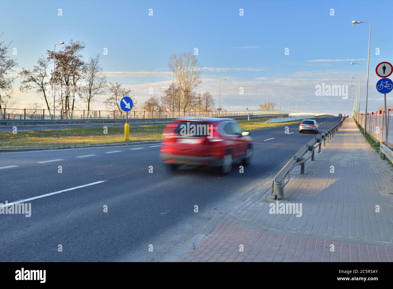 Auto when driving at long shutter speeds. Motion blur. Spring. Stock Photo