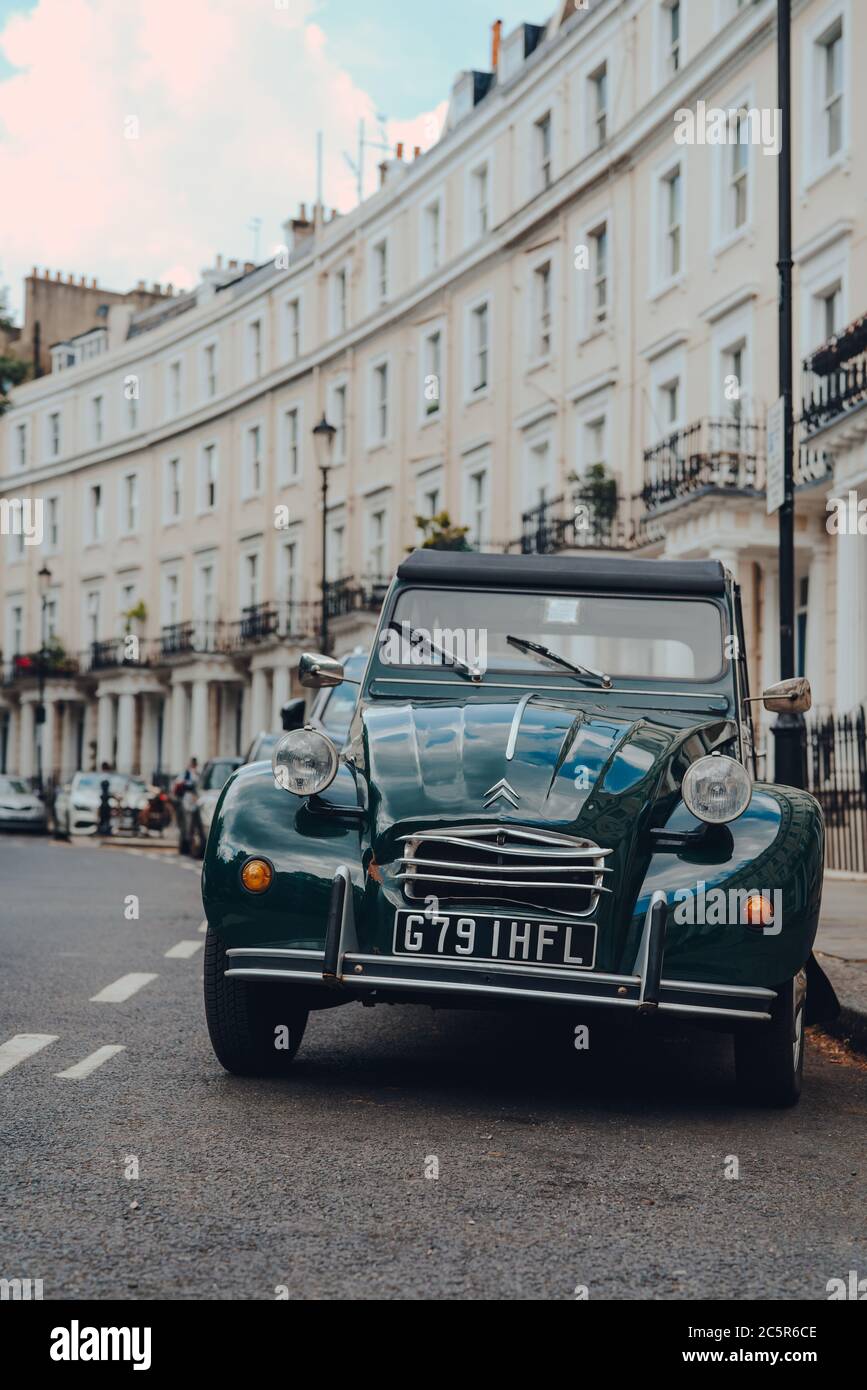 London, UK - June 20, 2020: Close up of an Old Citroen 2CV parked on a street in Holland park, an affluent area of West London favoured by celebrities Stock Photo
