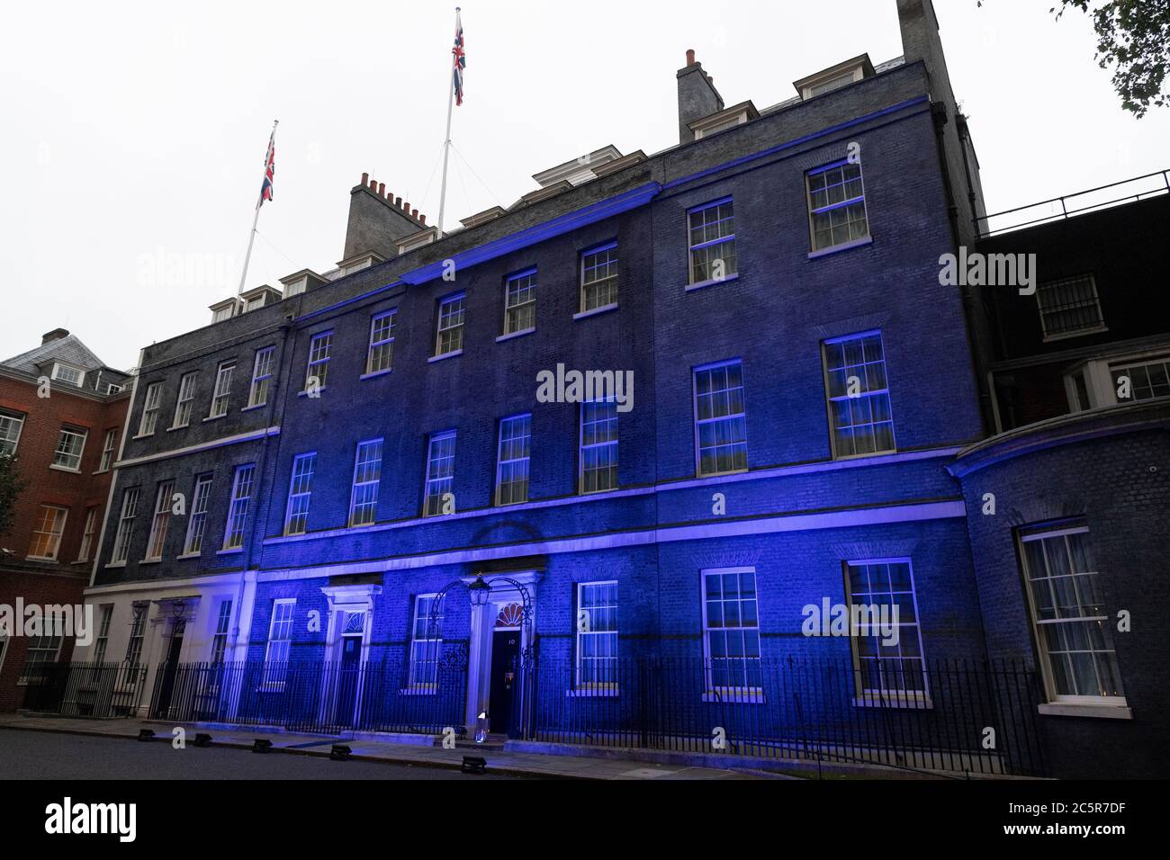 04 July 2020. London, United Kingdom.  A candle is placed at the front of Downing St as the building is lit with blue lighting to honour and mark the 72nd birthday of the National Health Service. Photo by Ray Tang/Ray Tang Media Stock Photo