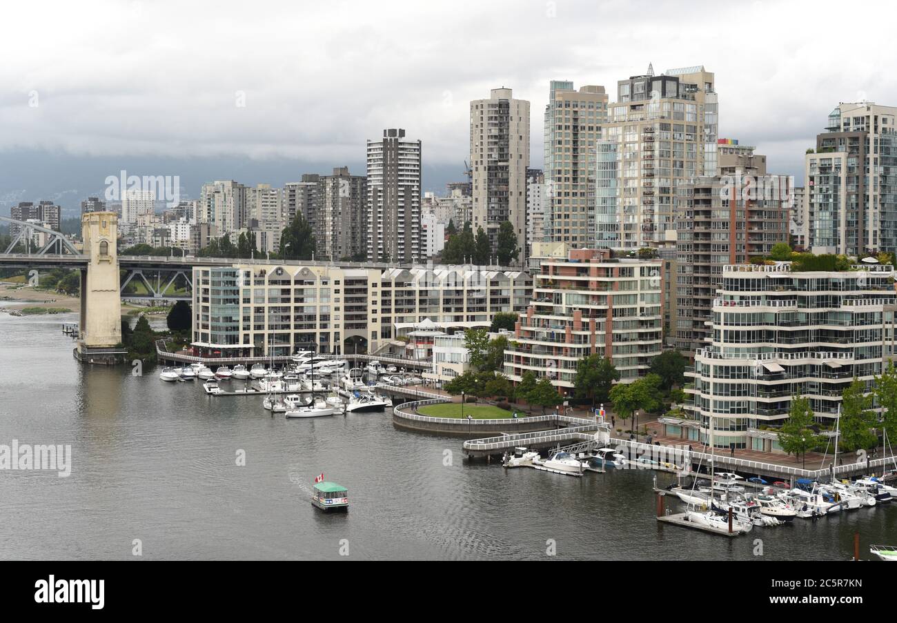 A view over the waters of False Creek, the Burrard Street Bridge and ...