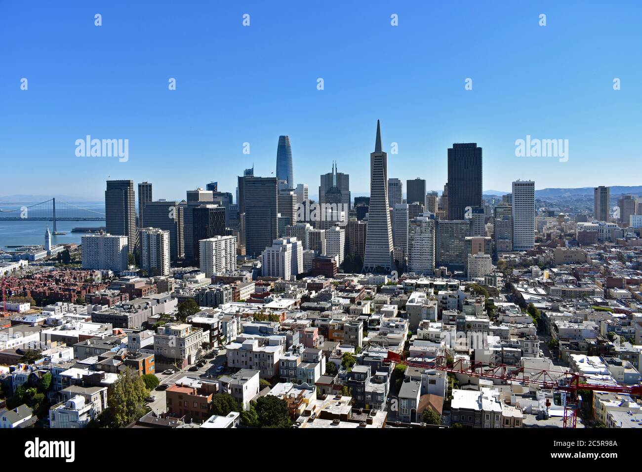 Downtown San Francisco, Bay Bridge, Transamerica Pyramid and streets from the top of Coit Tower on Telegraph Hill.  San Francisco, California. Stock Photo