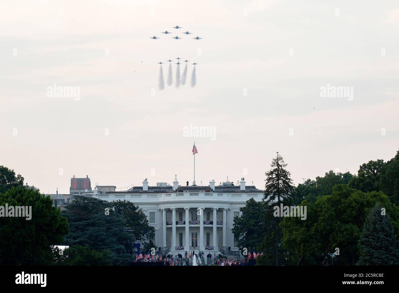 Washington, DC, USA. 4th July, 2020. U.S. Navy Blue Angel fighter jets and U.S. Air Force Thunderbirds fly over the White House as United States President Donald J. Trump participates in his Fourth of July 'Salute to America' event in Washington, DC, U.S., on Saturday, July 4, 2020. Trump pushed forward with his planned Fourth of July celebration, even as many officials urged the public to stay home and avoid gathering in large crowds due to the ongoing Coronavirus pandemic. Credit: Stefani Reynolds/CNP | usage worldwide Credit: dpa/Alamy Live News Stock Photo