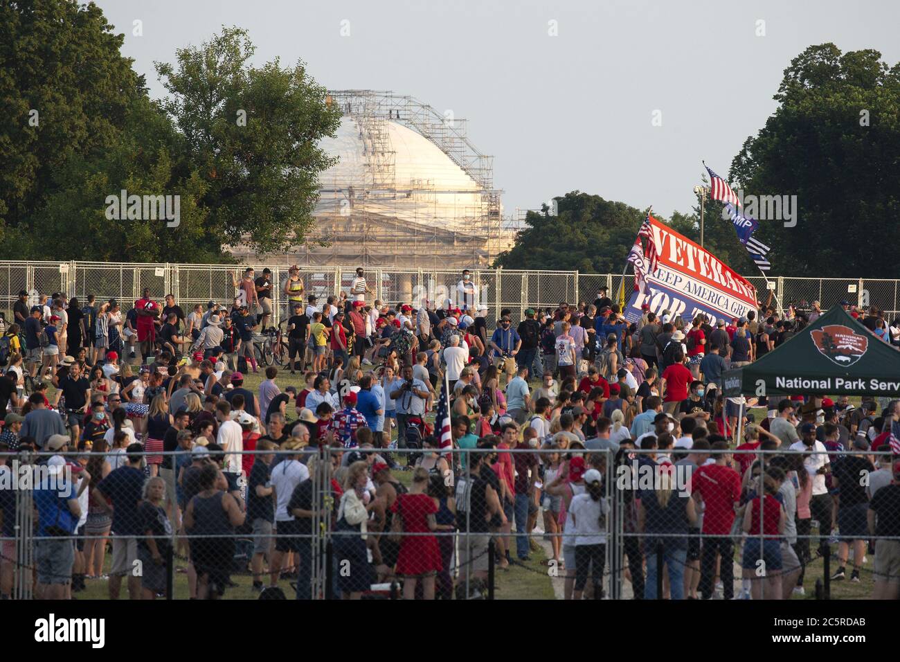 Washington, United States. 04th July, 2020. A crowd gathers to watch United States President Donald J. Trump's Fourth of July 'Salute to America' event across from the White House in Washington, DC on Saturday, July 4, 2020. Trump pushed forward with his planned Fourth of July celebration, even as many officials urged the public to stay home and avoid gathering in large crowds due to the ongoing Coronavirus pandemic. Photo by Stefani Reynolds/UPI Credit: UPI/Alamy Live News Stock Photo