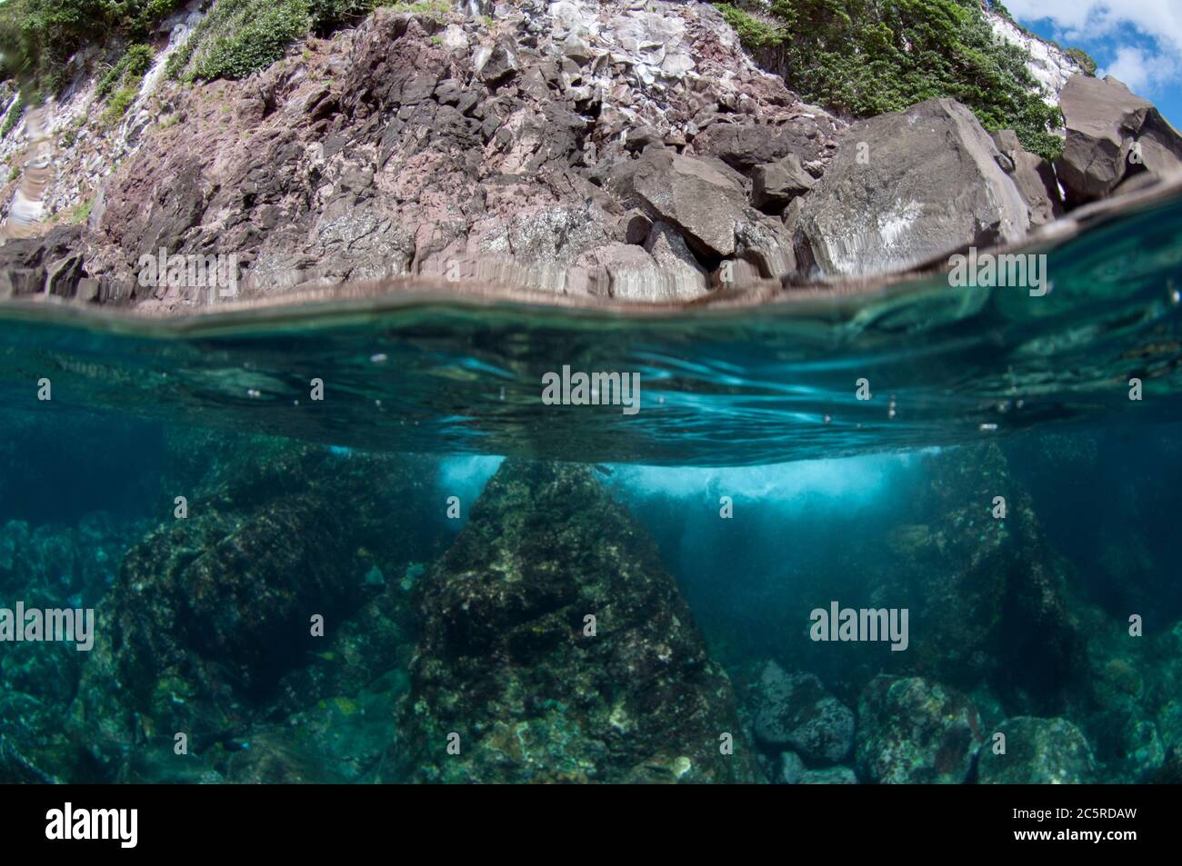 Island split shot, Red Cliff dive site, Manuk Island, Indonesia, Banda