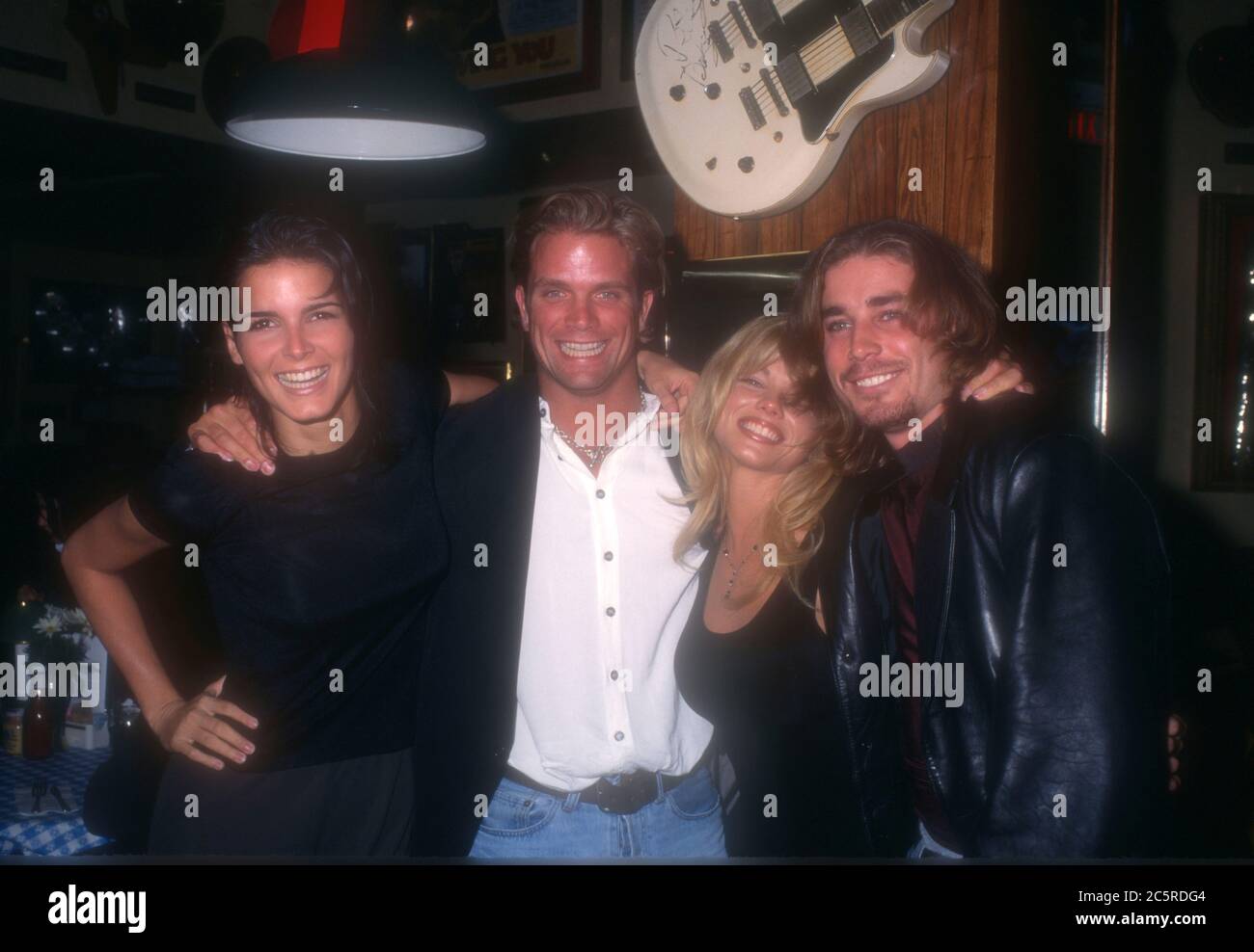 Los Angeles, California, USA 4th December 1995 (L-R) Actress Angie Harmon, actor David Chokachi, actress Donna D'Errico and actor Jaason Simmons attend event at Hard Rock Cafe on December 4, 1995 in Los Angeles, California, USA. Photo by Barry King/Alamy Stock Photo Stock Photo