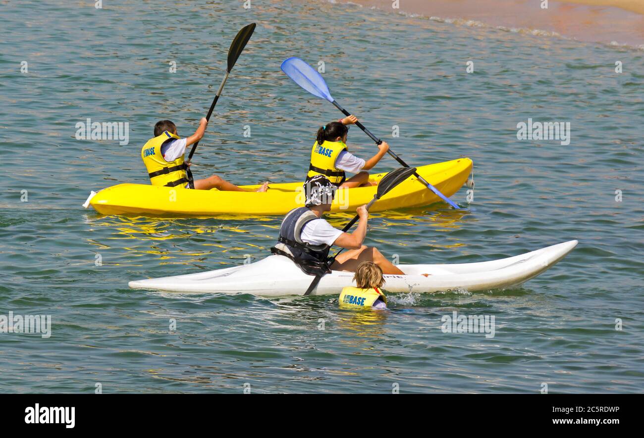 BARCELONA, SPAIN - JULY 14, 2015: A group of people doing sea kayaking at the beach Barceloneta.  Barcelona, Spain - July 14, 2015: A group of people Stock Photo