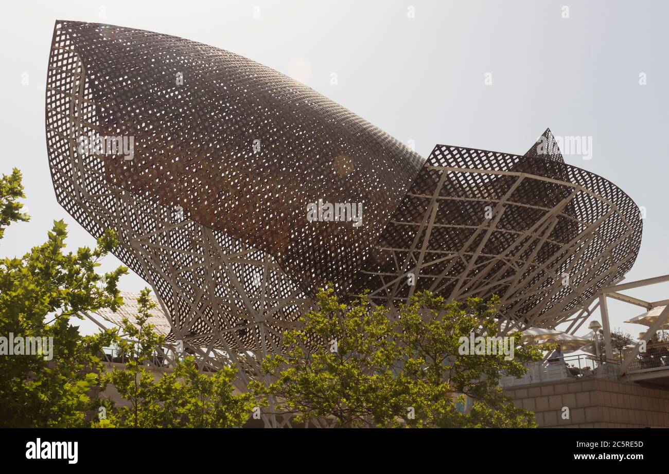 BARCELONA, SPAIN - JULY 4, 2015: Frank Gehry's modern El Peix d'Or sculpture is located in Barcelona's Vila Olimpica, Olympic Village for the 1992 Oly Stock Photo