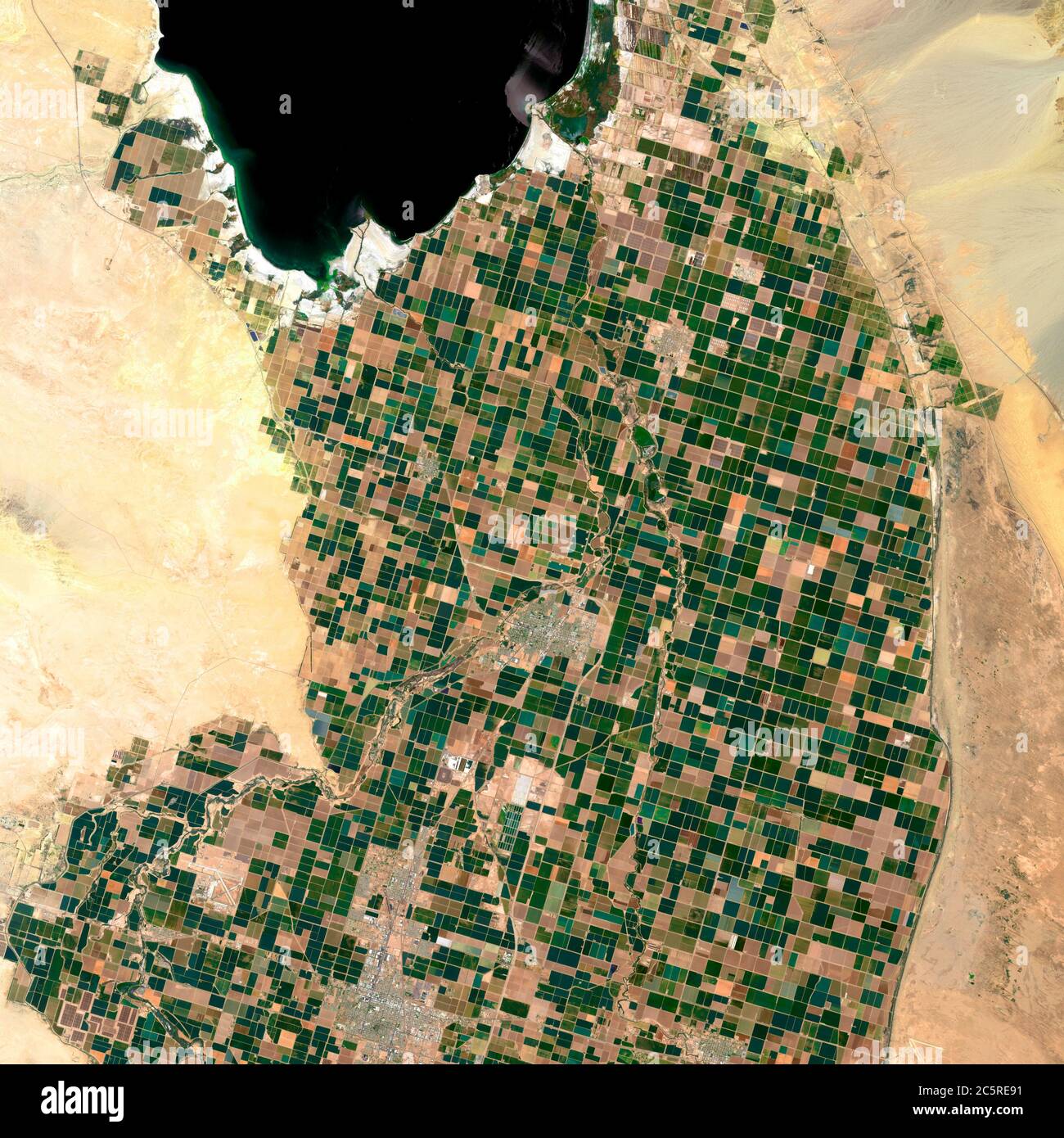 Image satellite of the presence crops and andcities. Sonora desert of Brawley, California, EUA. Observation of the surface of the earth from the sky. Stock Photo