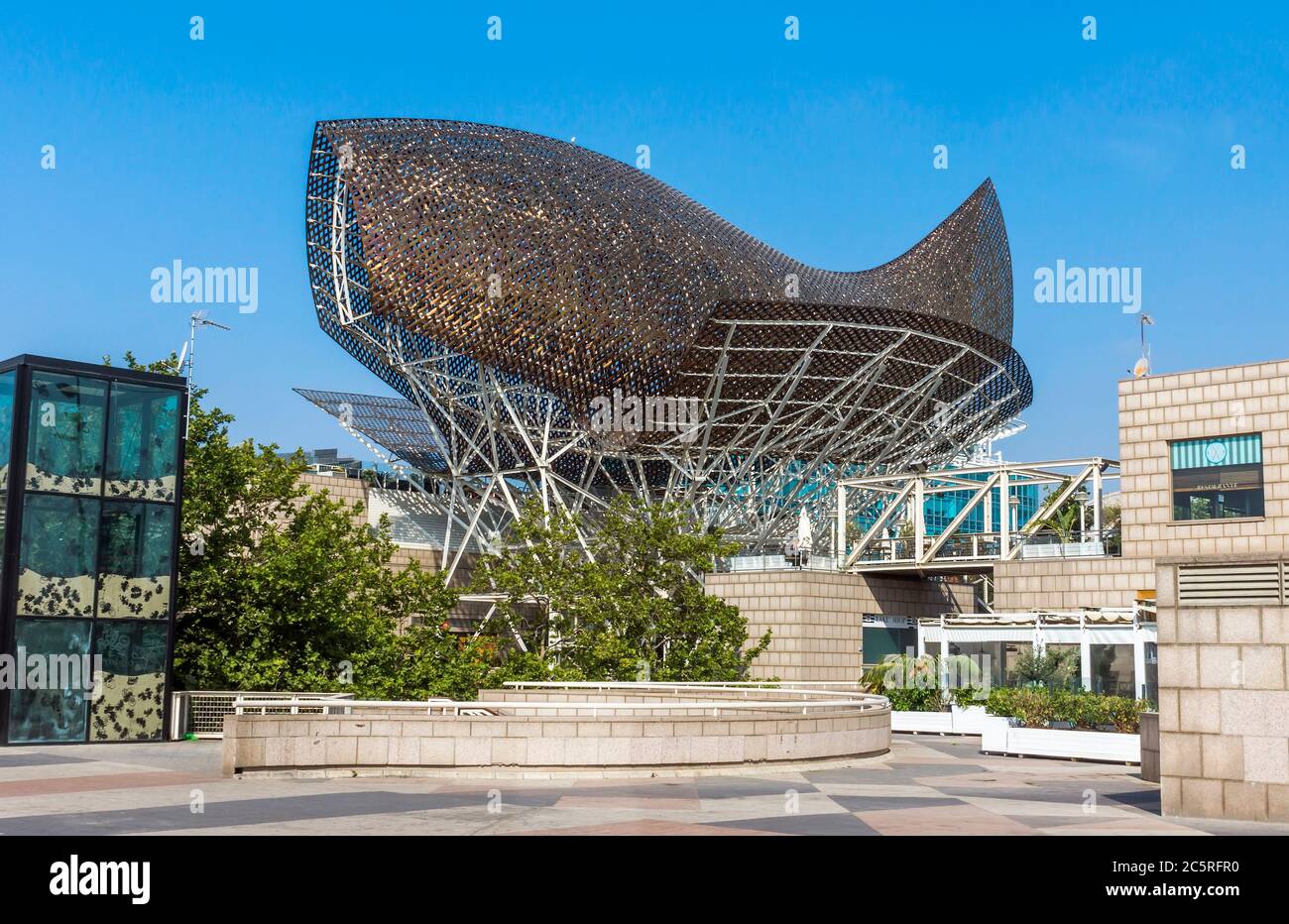 BARCELONA, SPAIN - JULY 12, 2015: Frank Gehry's modern El Peix d'Or sculpture is located in Barcelona's Vila Olimpica, Olympic Village for the 1992 Ol Stock Photo