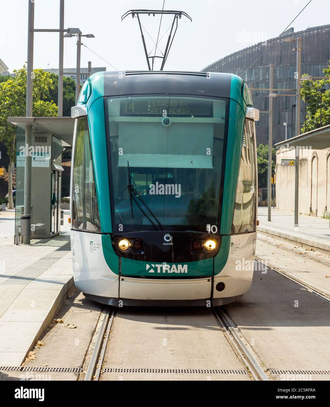 BARCELONA, SPAIN - JULY 12, 2015: Barcelona tram known as Trambaix. The tram is going through the Diagonal avenue.  Barcelona, Spain - July 12, 2015: Stock Photo