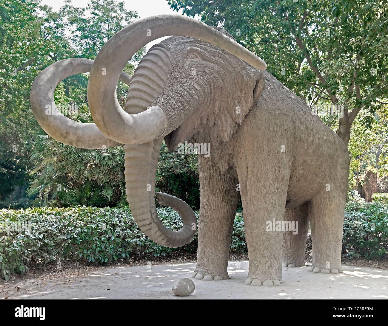 BARCELONA, SPAIN - JULY 12, 2015: Mammoth statue in Parc de la Ciutadella in Barcelona, Spain.  Barcelona, Spain - July 12, 2015: Mammoth statue in Pa Stock Photo