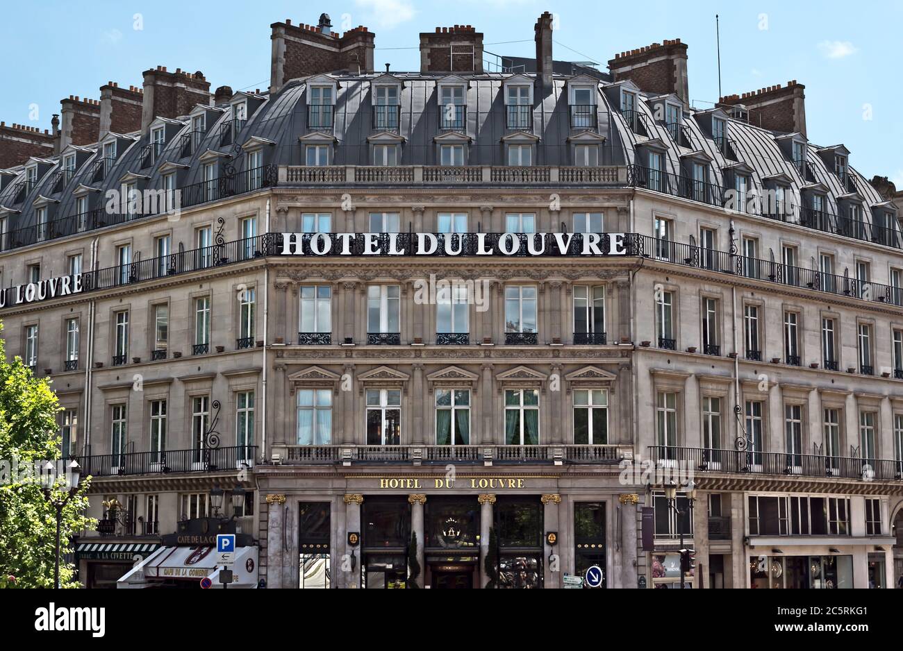 PARIS, FRANCE - JUNE 11, 2014: Facade of the Grand Hotel du Louvre, Hyatt Hotel in Paris. Located near Louvre Palace in a beautiful historic building Stock Photo