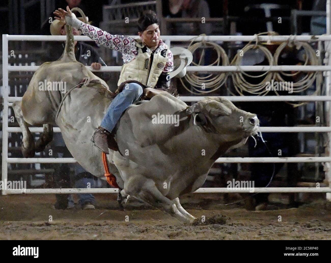 Prescott, AZ, USA. 3rd July, 2020. Jesse Flores, from Valinda, California, competes in the Bull Riding event during the 133rd Prescott Frontier Days Rodeo in Prescott, Arizona Friday July 3, 2020. The rodeo, the longest running in the world, continued on despite the coronavirus pandemic with fan capacity limited to 25 percent at the venue. Credit: Will Lester/ZUMA Wire/Alamy Live News Stock Photo