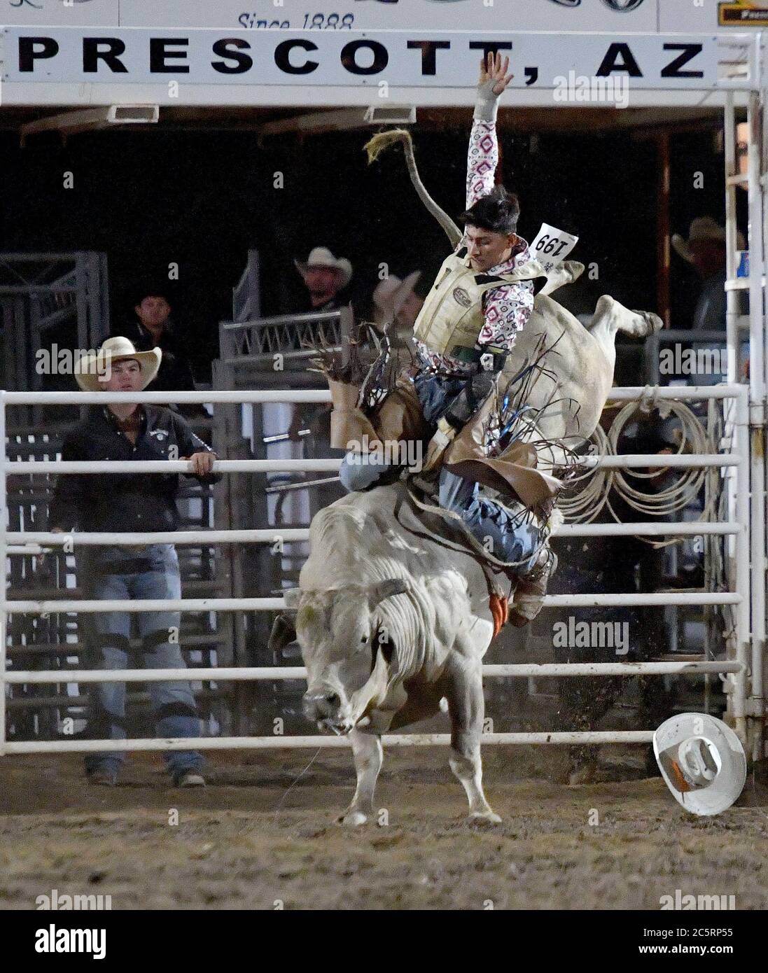Prescott, AZ, USA. 3rd July, 2020. Jesse Flores, from Valinda, California, competes in the Bull Riding event during the 133rd Prescott Frontier Days Rodeo in Prescott, Arizona Friday July 3, 2020. The rodeo, the longest running in the world, continued on despite the coronavirus pandemic with fan capacity limited to 25 percent at the venue. Credit: Will Lester/ZUMA Wire/Alamy Live News Stock Photo