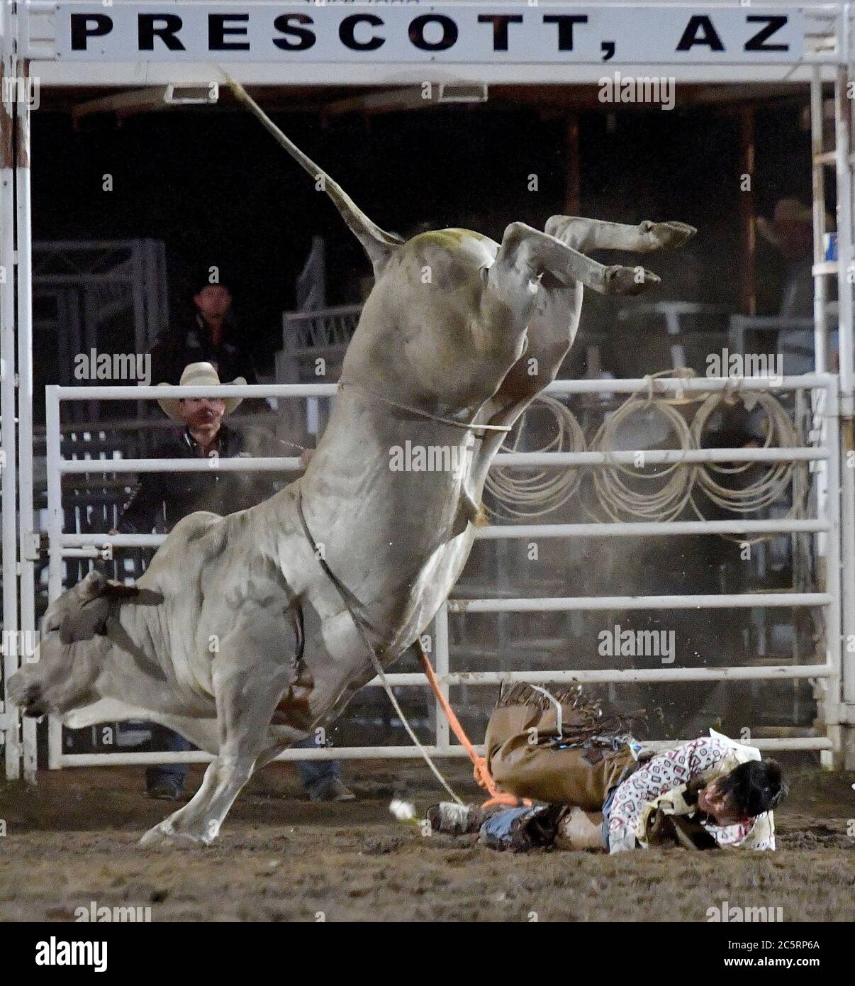 Prescott, AZ, USA. 3rd July, 2020. Jesse Flores, from Valinda, California, is thrown to the ground as he competes in the Bull Riding event during the 133rd Prescott Frontier Days Rodeo in Prescott, Arizona Friday July 3, 2020. The rodeo, the longest running in the world, continued on despite the coronavirus pandemic with fan capacity limited to 25 percent at the venue. Credit: Will Lester/ZUMA Wire/Alamy Live News Stock Photo