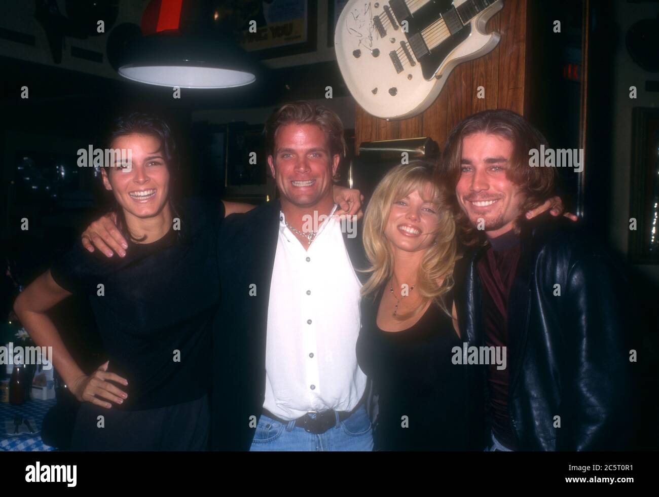 Los Angeles, California, USA 4th December 1995 (L-R) Actress Angie Harmon, actor David Chokachi, actress Donna D'Errico and actor Jaason Simmons attend event at Hard Rock Cafe on December 4, 1995 in Los Angeles, California, USA. Photo by Barry King/Alamy Stock Photo Stock Photo